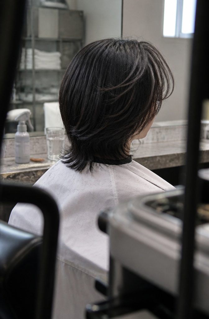 Straight hair with a wispy fringe blending into a middle part