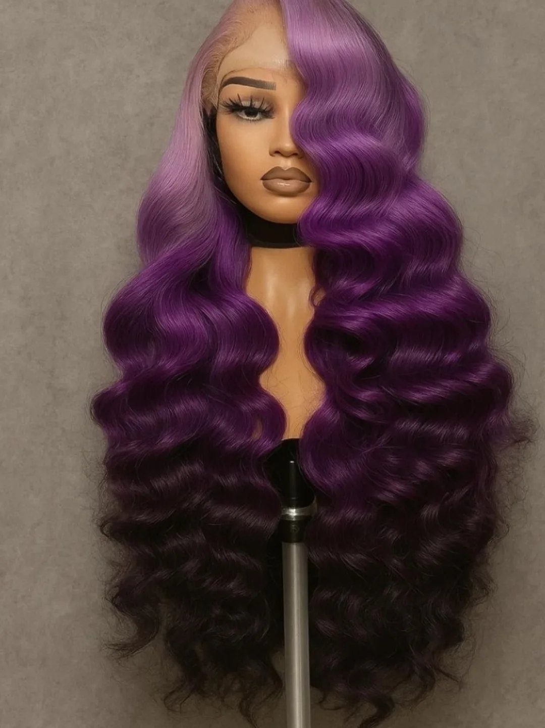 Mannequin displaying a long purple wig with voluminous waves and curls