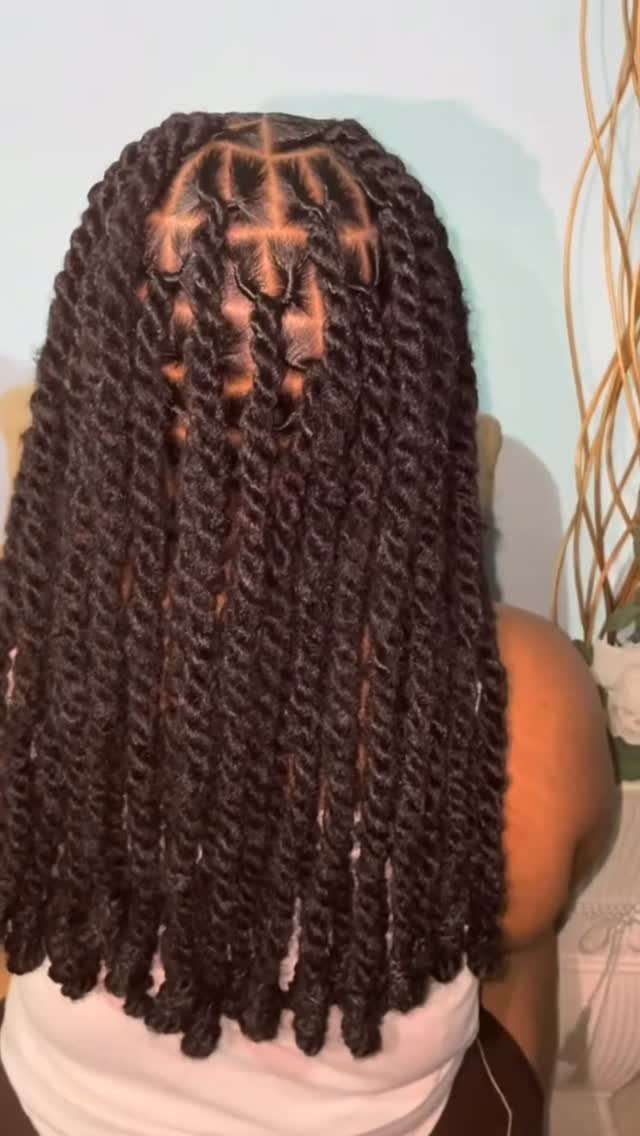 Long, dark natural twists arranged in neat scalp sections