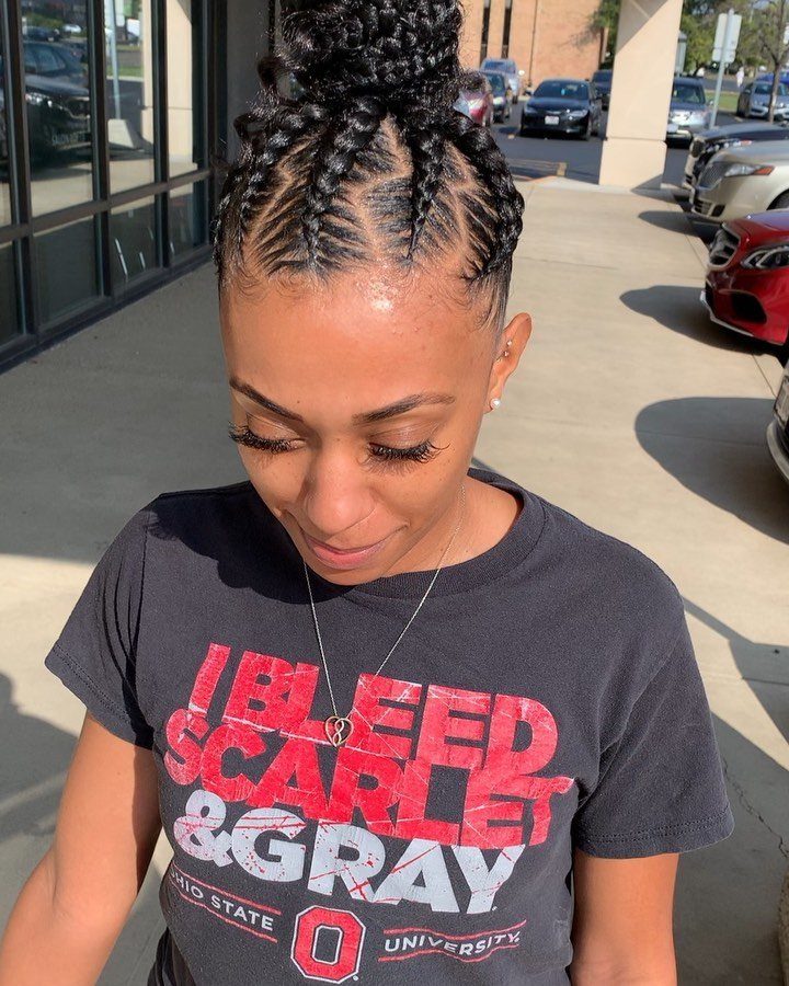 Scalp braids gathered into a large braided bun on a person's head