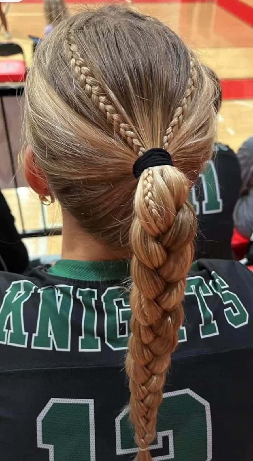 Blonde French braid ponytail with two braids joining at a black hair tie