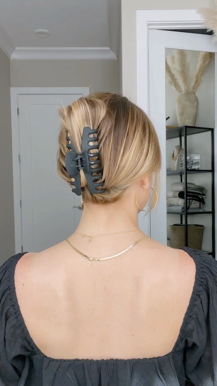 Blonde twisted updo secured with a large dark claw clip