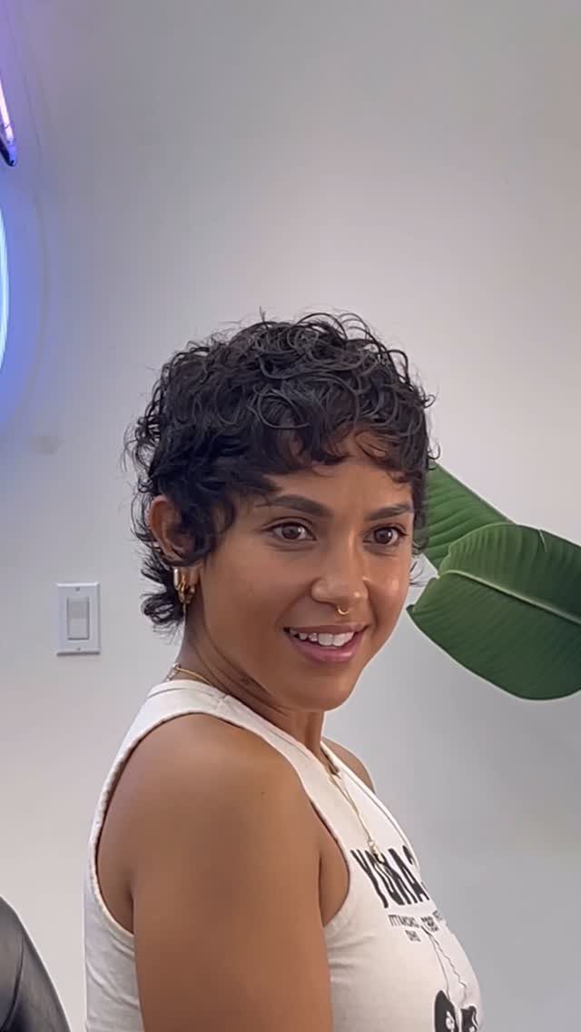 Short curly pixie cut with longer textured curls on top