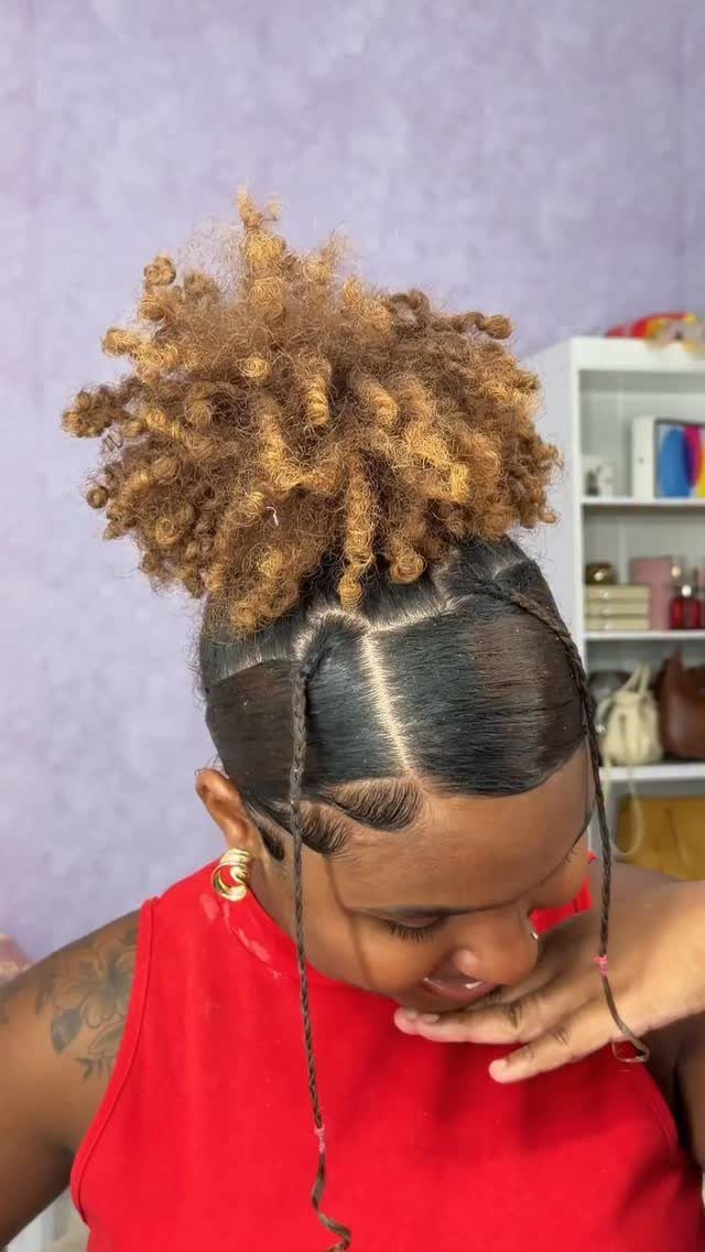 Golden-brown curls gathered high above sleek dark hair with a center part