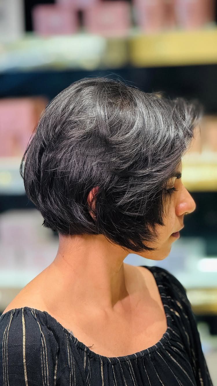 Short layered bob with wispy ends framing the face