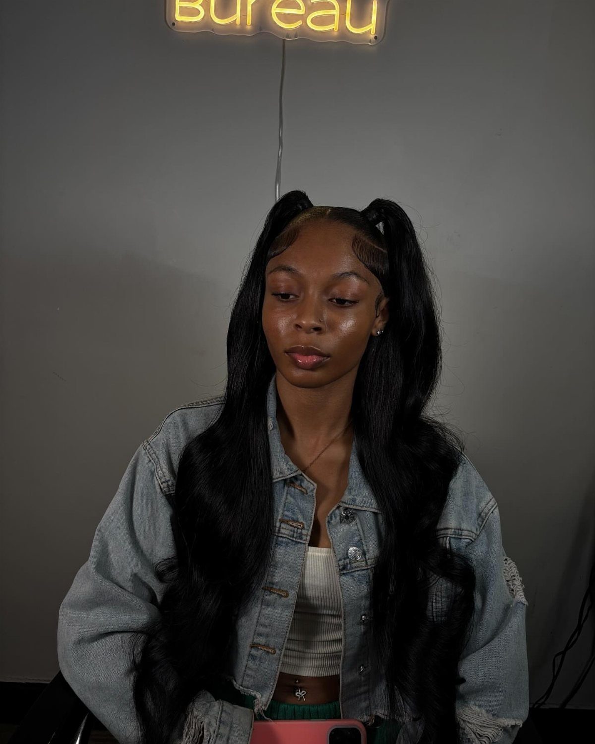 Woman wearing long half-up pigtails with the rest of her hair down