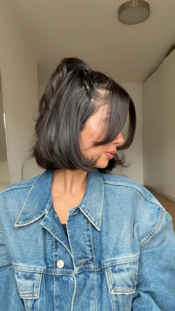 Short dark bob styled half up, with the remaining hair left down