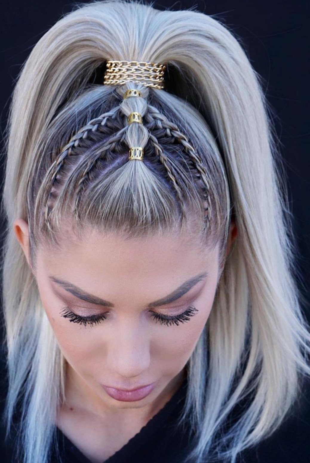 Platinum blonde hair with braided crown sections and a high half-up ponytail