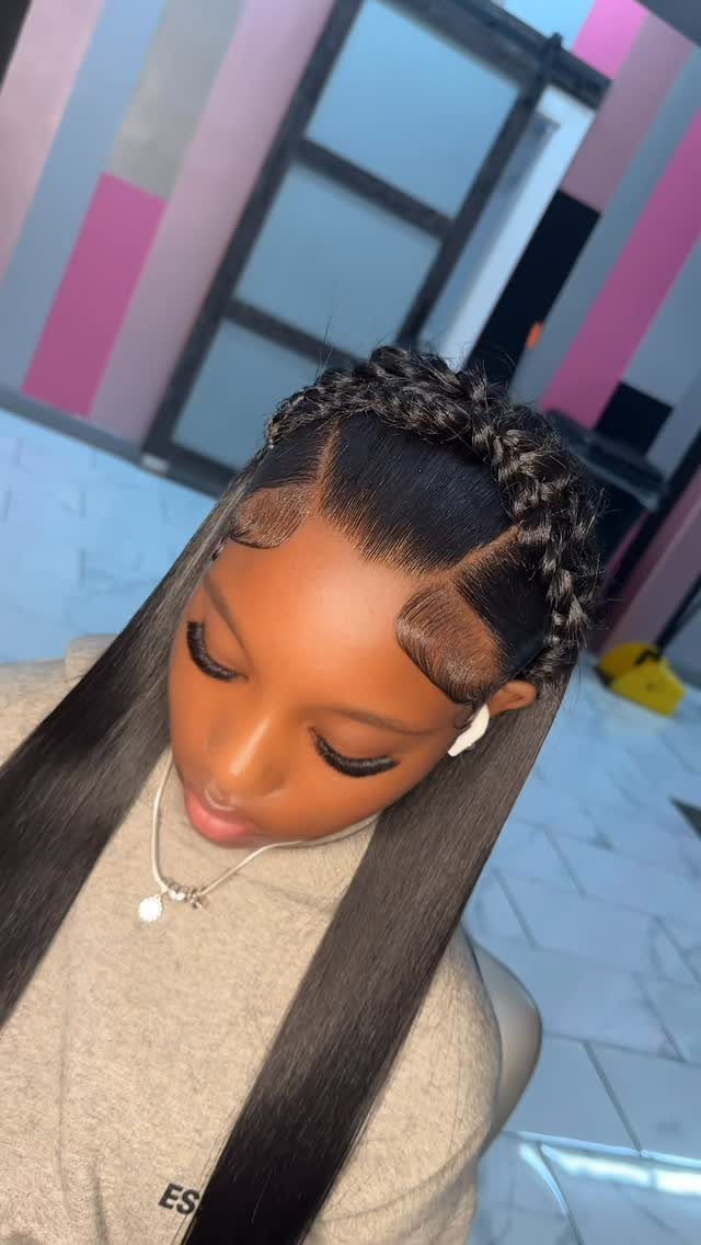 Woman wearing a chunky crown braid with long straight hair
