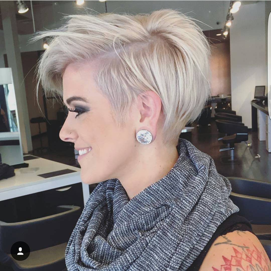 Platinum-blonde pixie haircut with tousled top layers and cropped sides