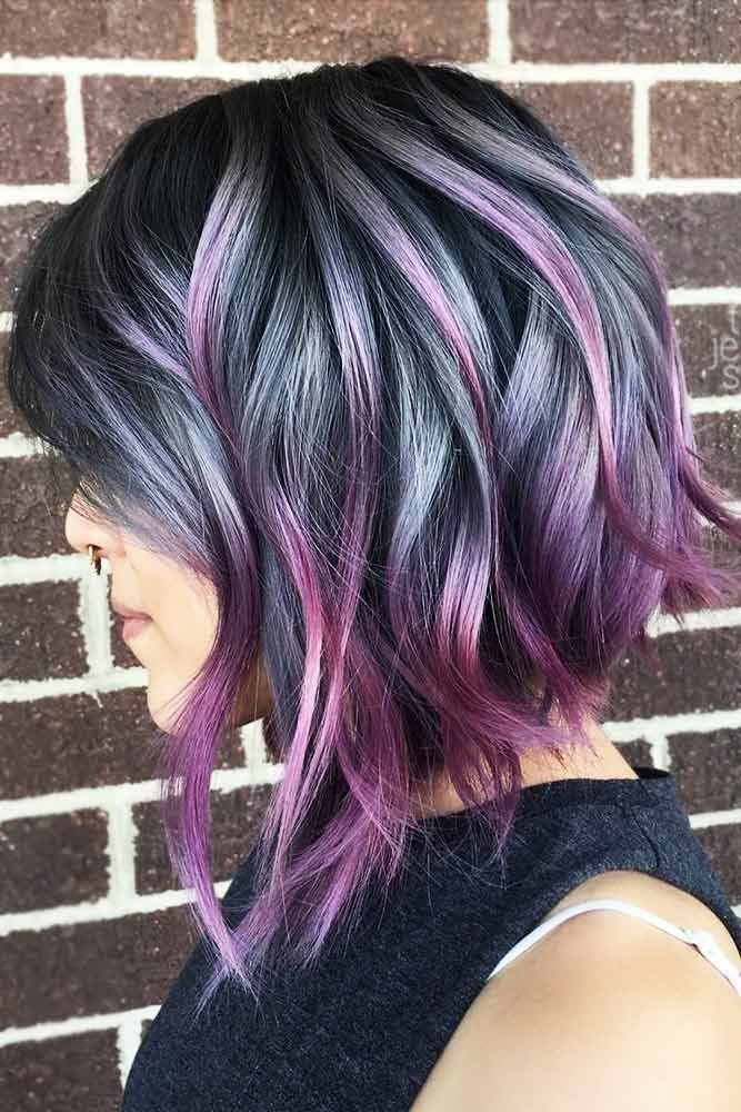 Layered black bob with purple and magenta highlights, longer at the front
