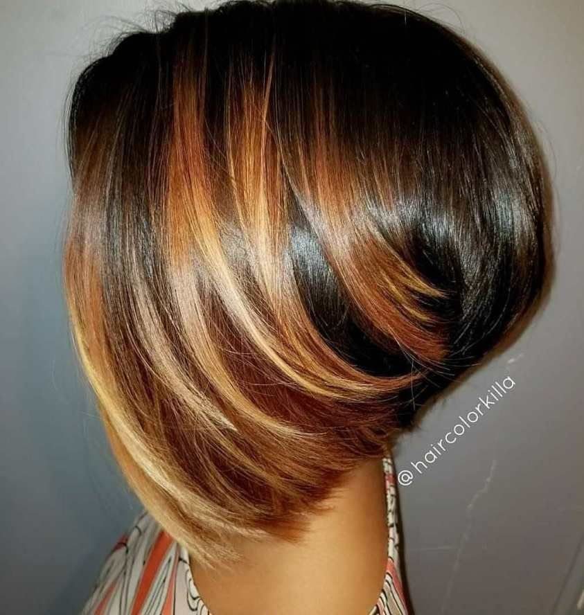 Stacked dark brown bob with sweeping blonde highlights, viewed from behind