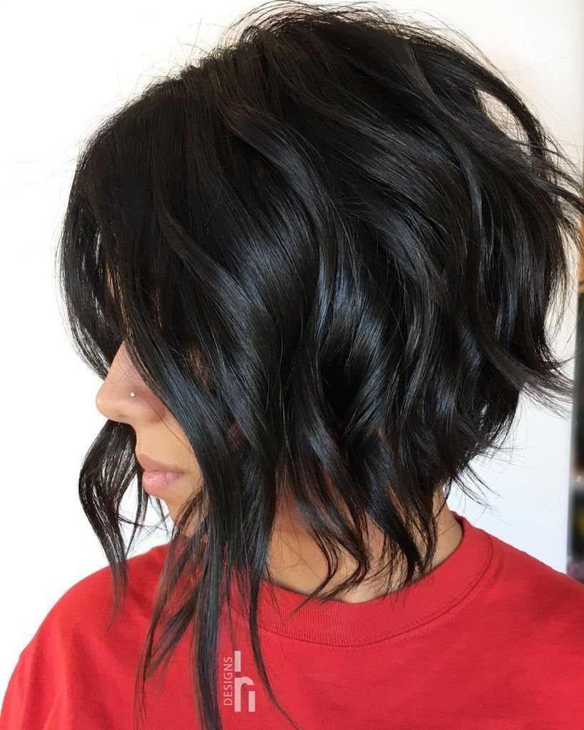 Dark wavy asymmetrical bob with longer face-framing front sections