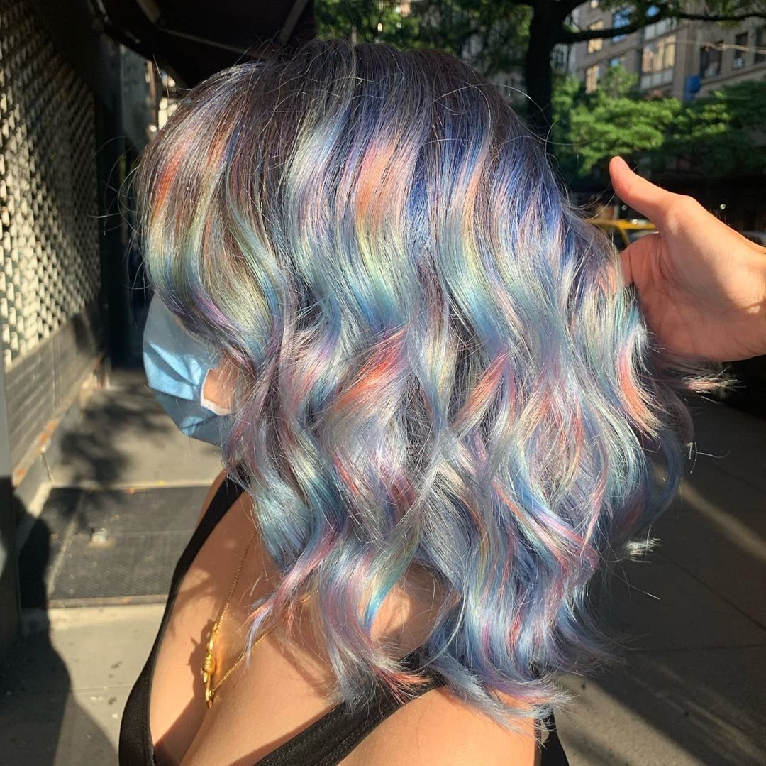 Wavy silver hair with pastel lavender, pink, mint, and blue highlights
