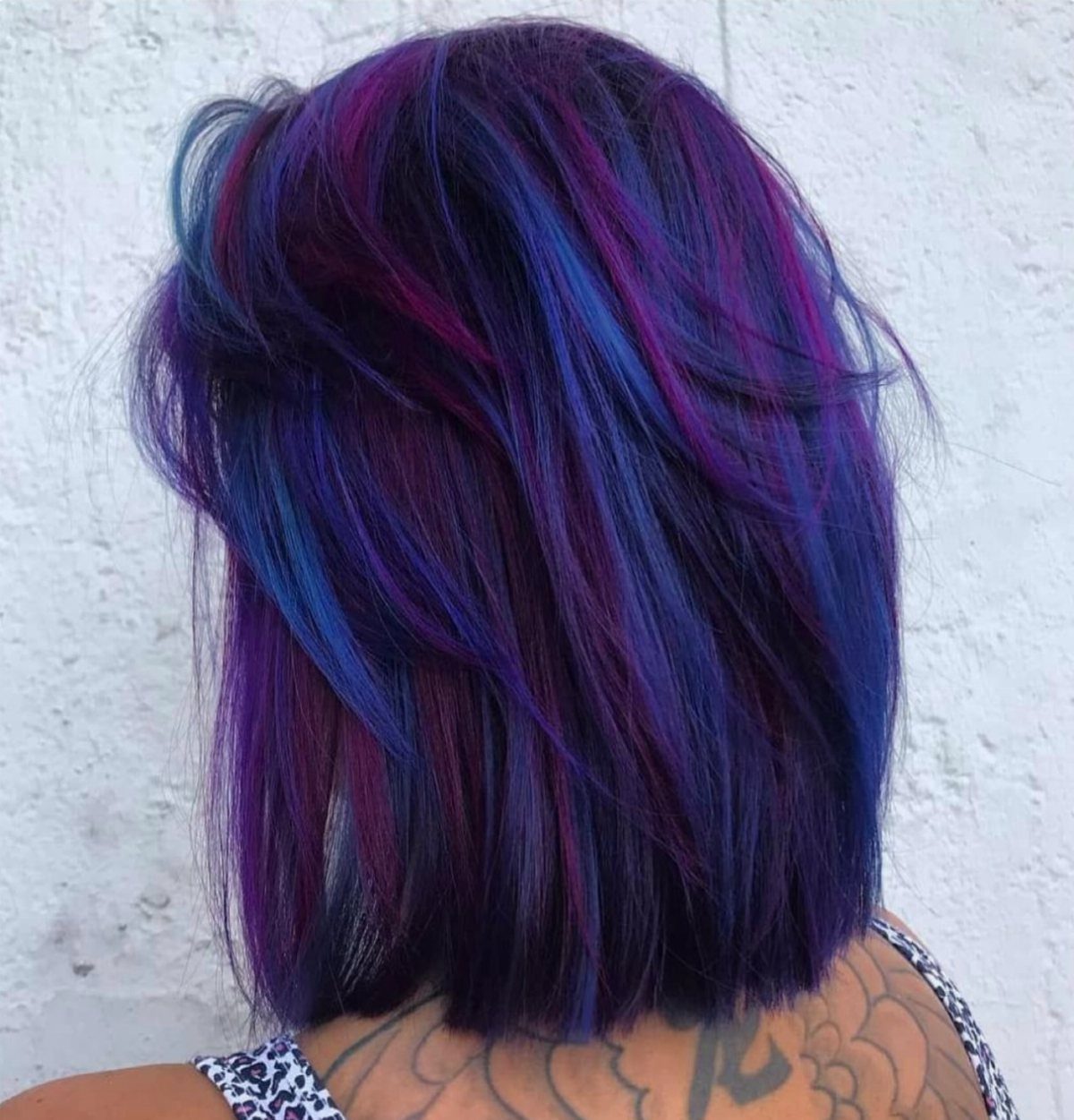Layered bob with plum, violet, blue, and magenta hair color