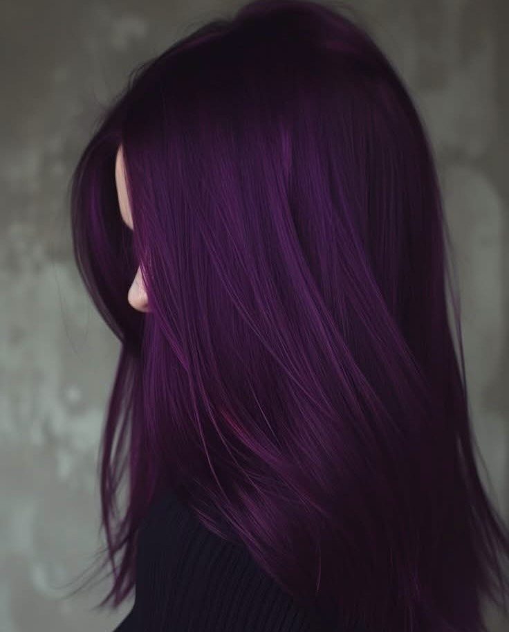Long, straight plum-purple hair flowing over a person’s shoulder in profile