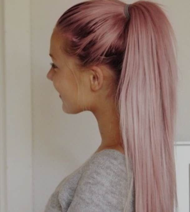 Long high ponytail fading from deep pink roots to pale rose-blonde lengths