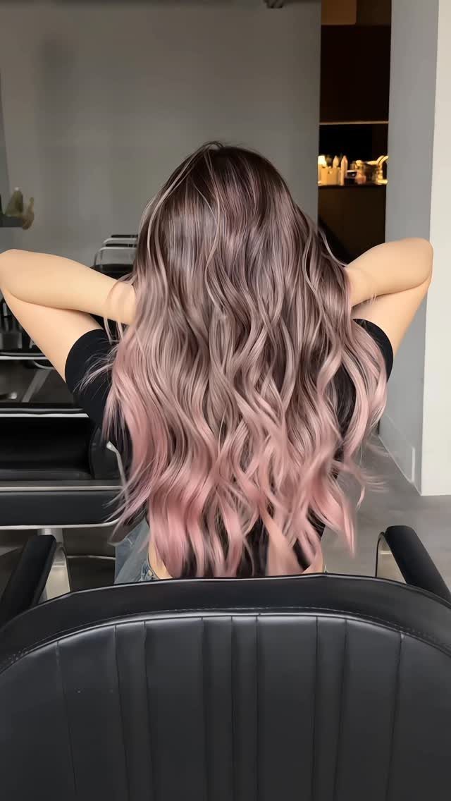 Long dusty rose waves blend darker roots into pale pink ends