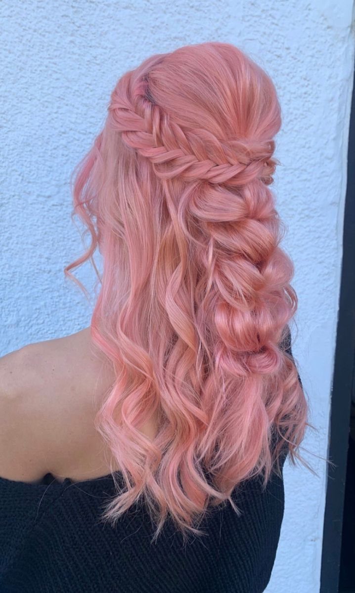 Rose-gold curls gathered into braided and twisted half-up sections