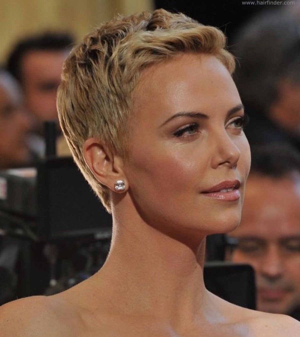 Woman with a choppy blonde pixie haircut, longer on top and cropped at the sides