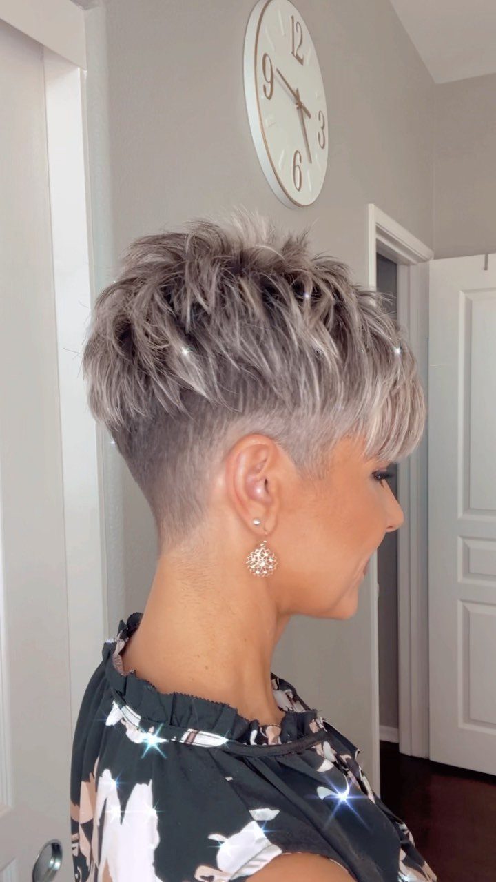 Short silver-gray pixie with tousled top and closely cropped sides