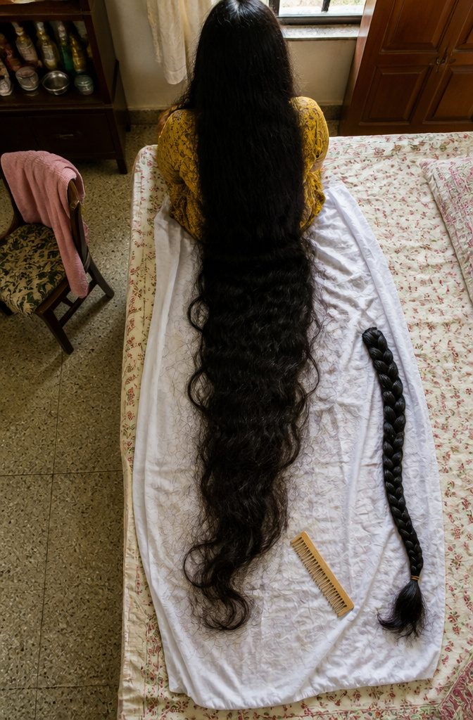Renu Dhariyal with her long hair gathered in an elaborate plait