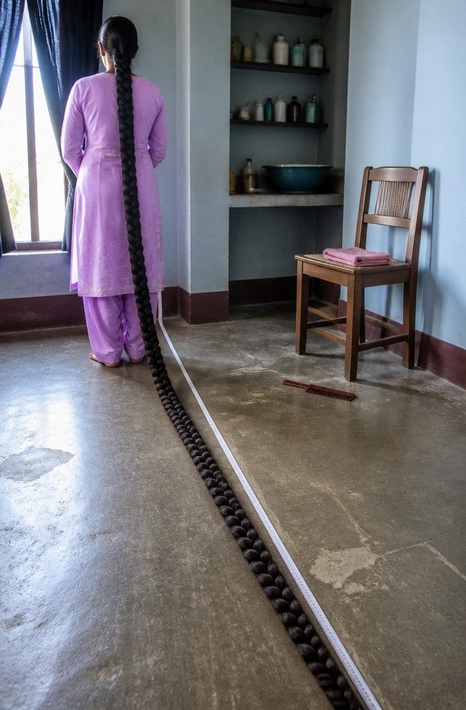 Renu Dhariyal seated beside her long hair reaching the floor